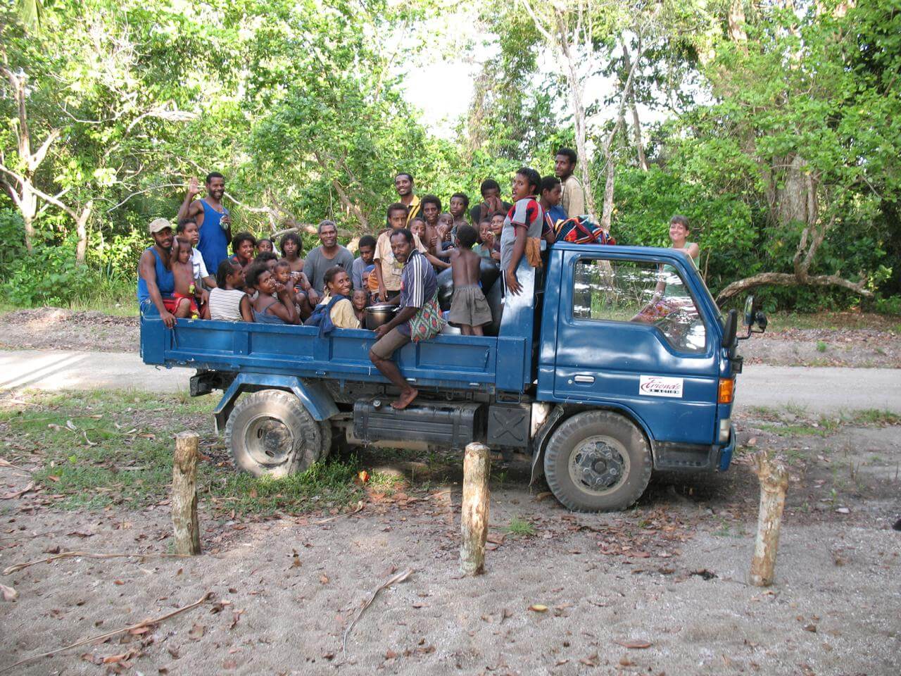 An image of villagers in the back of a work truck taken from FIA mission trip.