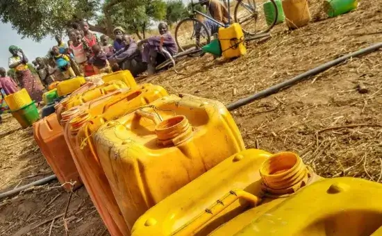 Banner image of water containers illustrating Friends In Actions, clean water initiative projects.