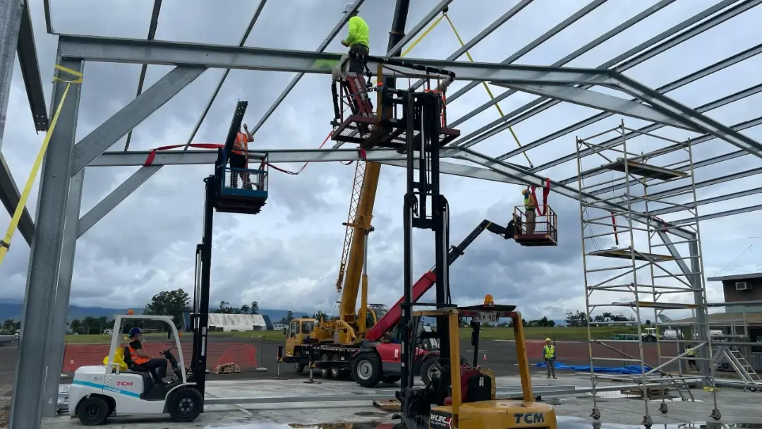 Echoes of His Grace - FIA volunteers building the hangar structure