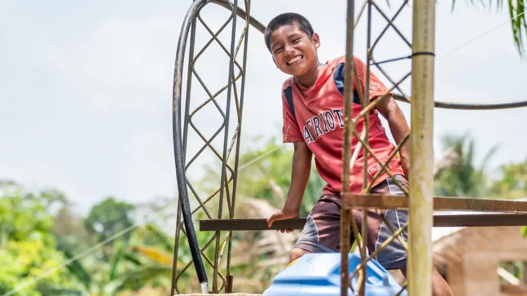 FIA volunteers assisting in drilling a well in West Africa.